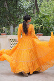 Banjara India Faux Georgette Bandhej Print with Gotta Patti Lace Work  Long Flair Lehenga Set - Mango